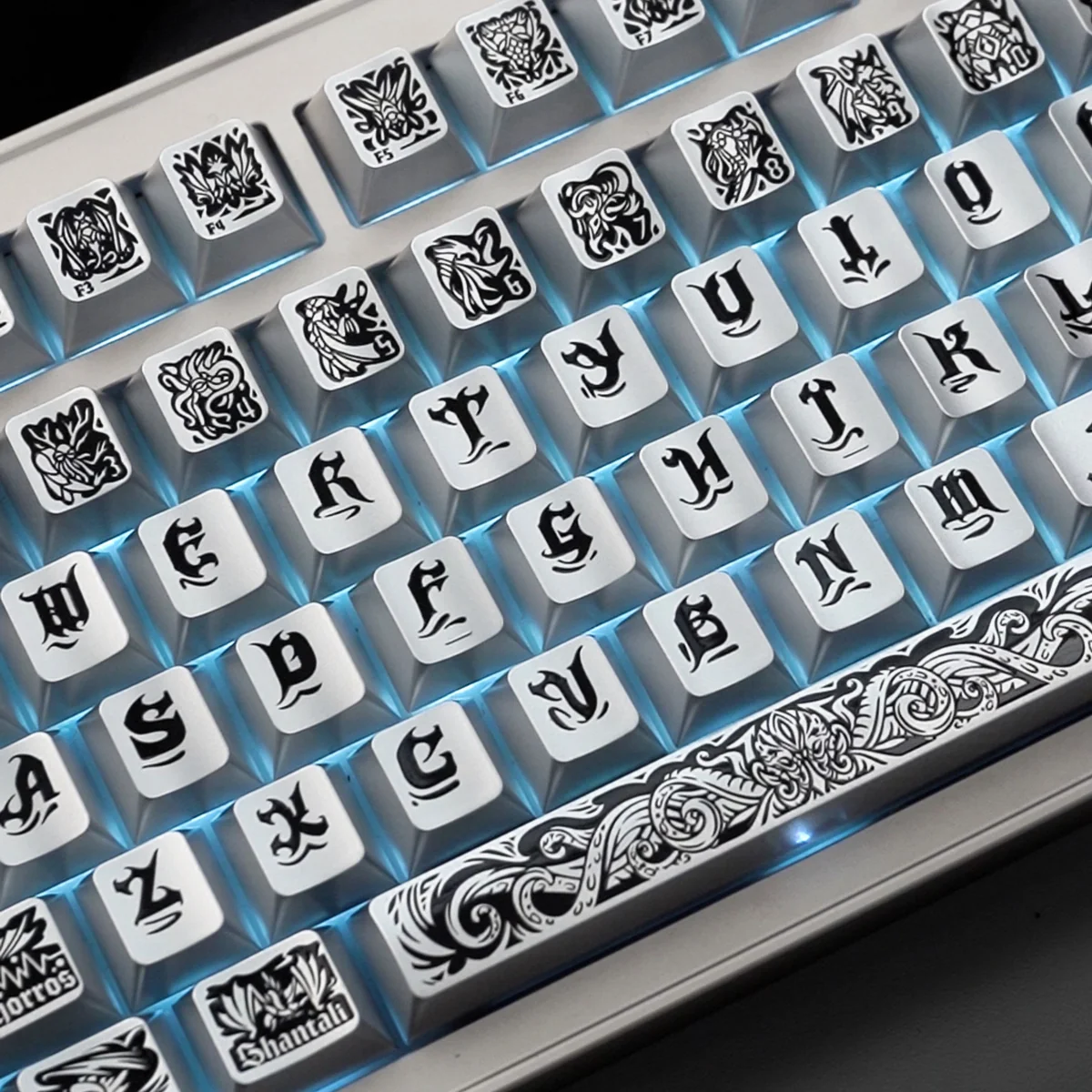Artistic shot of Cthulhu PBT keycaps set from multiple angles, highlighting their intricate tactile relief, metallic silver finish, and dark cosmic horror design.