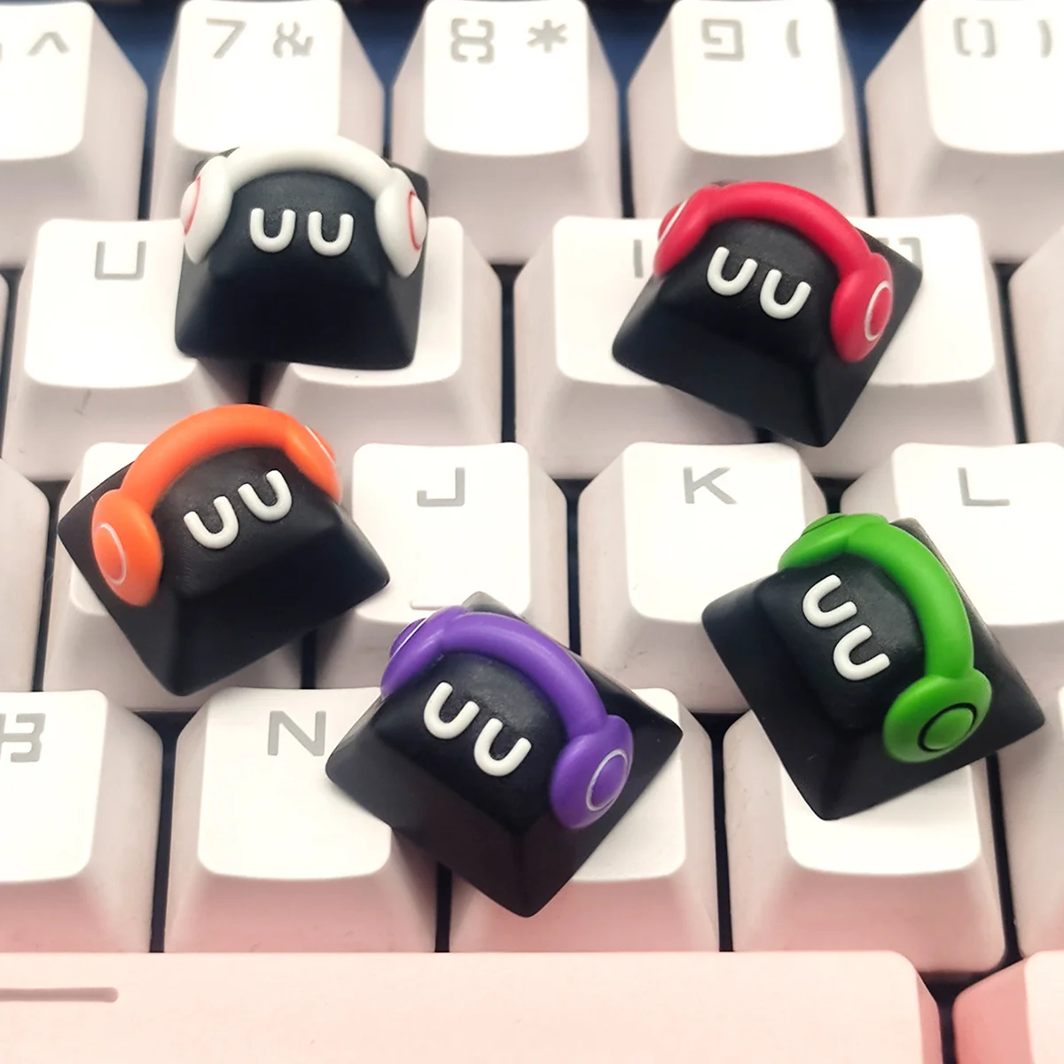 A gallery of delightful handcrafted playful monster artisan resin keycaps, showcasing various angles of the colorful Cherry profile design with charming details.