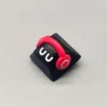Playful monster artisan resin keycap in Cherry profile, showcasing its adorable handcrafted, whimsical design and vibrant colors from various angles.