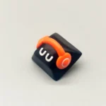 Close-up of a vibrant red playful monster artisan resin keycap, meticulously handcrafted with charming whimsical details, perfect for custom keyboard.