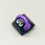 Close-up of a white playful monster artisan resin keycap, meticulously handcrafted with whimsical details, adding a charming touch to any keyboard.