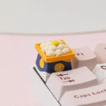 Close-up of a handcrafted Dango keycaps, revealing its whimsical Japanese aesthetic with a gentle, round character in a serene moon-gazing scene.