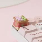 Handcrafted Dango keycaps featuring a whimsical flower-viewing scene, showcasing the delicate Japanese aesthetic and artisan craftsmanship.