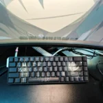 Exclusive Darker than Black Hei PBT keycaps set with mysterious side-lit legends, showcasing their unique stealthy design from an artistic angle.