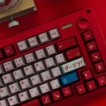 DARLING FRANXX PBT keycap set viewed from multiple angles, showcasing its futuristic anime aesthetic and distinctive metallic sheen.