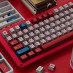 DARLING FRANXX PBT Keycap Set displayed from various artistic angles. Highlights its futuristic anime aesthetic and distinctive metallic sheen.