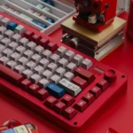 Detailed view of the DARLING FRANXX PBT keycaps set, revealing their unique futuristic anime aesthetic and radiant metallic luster from a new angle.