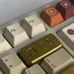 Close-up of the handcrafted Delta Force Pure Gold Bar artisan keycap, showcasing its intricate resin details and tactical design from a unique angle.