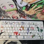 Close-up of artistic Demon Slayer PBT keycaps set, featuring vibrant side-printed anime characters and iconic motifs, perfectly designed for RGB backlight design.