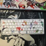 Artistic collection of Demon Slayer side-printed PBT keycaps set, highlighting vibrant anime designs and light-transmitting legends in diverse views.