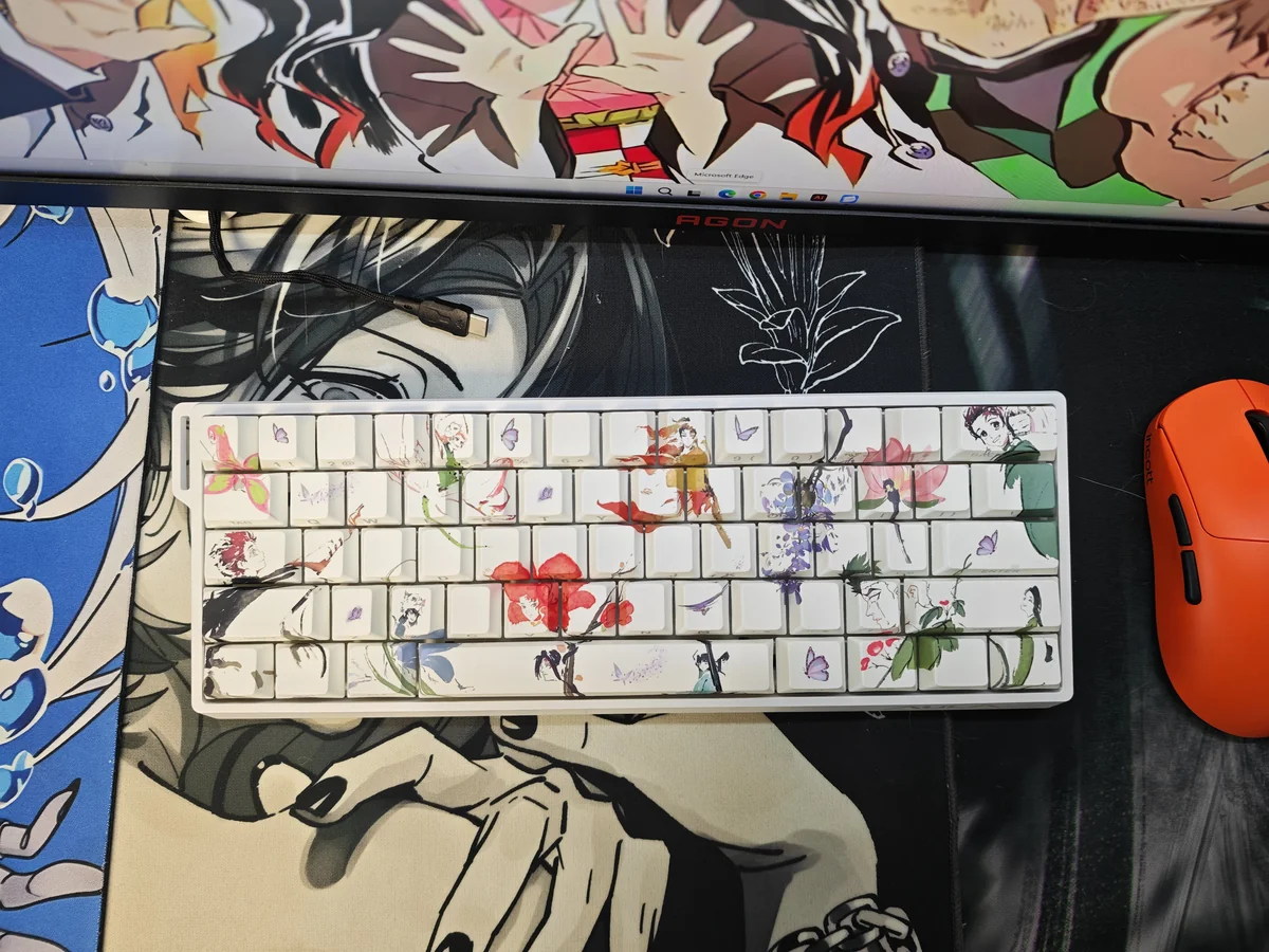 Artistic collection of Demon Slayer side-printed PBT keycaps set, highlighting vibrant anime designs and light-transmitting legends in diverse views.