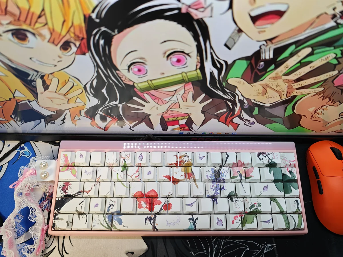 Vibrant Demon Slayer PBT keycaps set with side-printed legends, showcasing iconic anime characters and motifs from various angles, enhanced by RGB.
