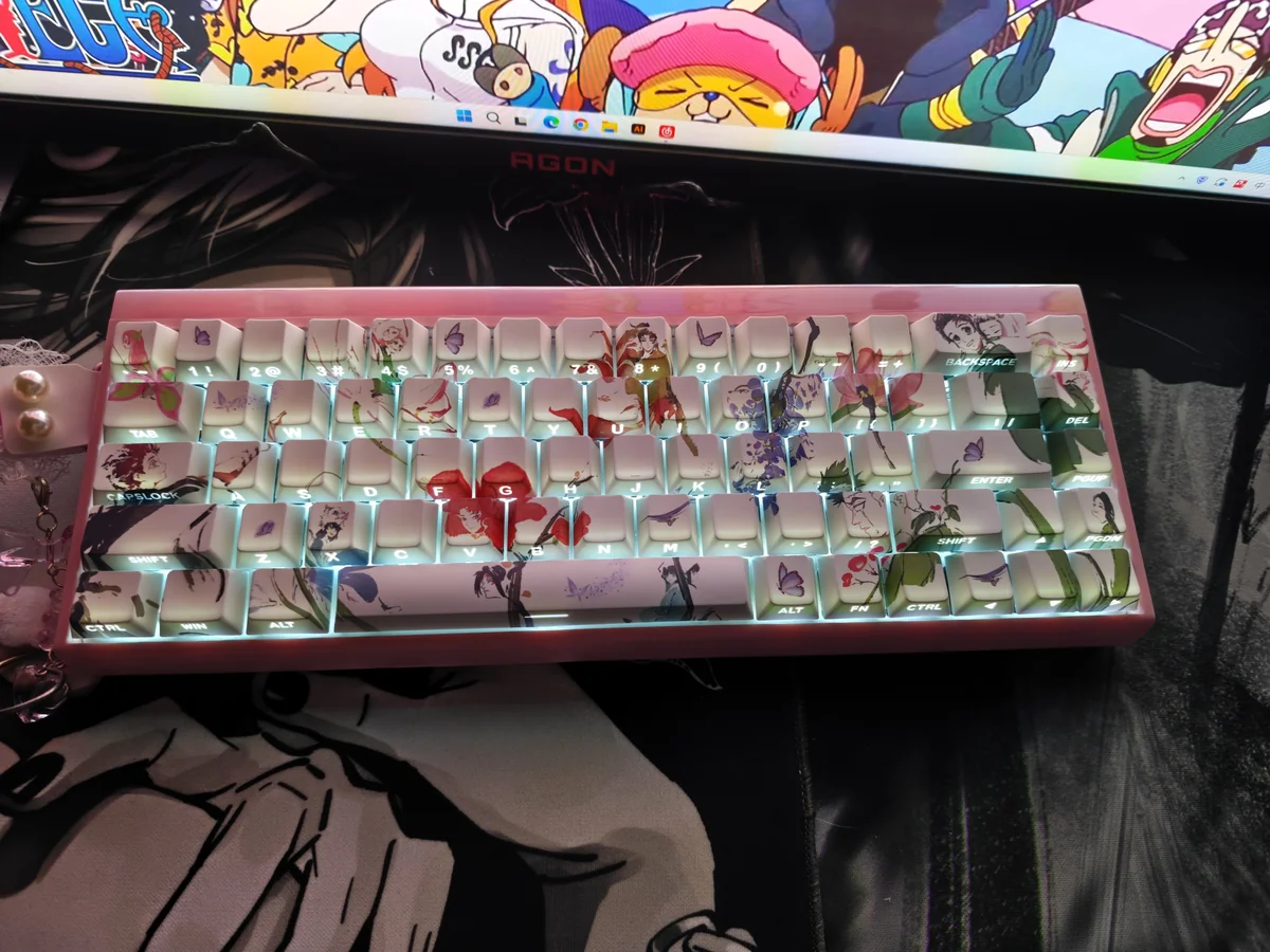 Artistic view of Demon Slayer PBT keycaps from multiple angles, highlighting vibrant side-printed characters and light-transmitting design for RGB keyboard.