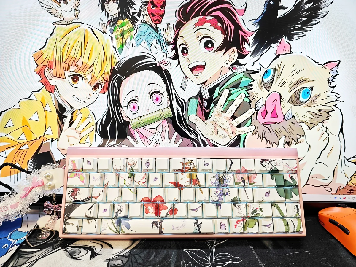 Vibrant Demon Slayer PBT keycaps set featuring iconic side-printed anime characters, optimized for RGB backlighting. Enhance your keyboard with this unique design.
