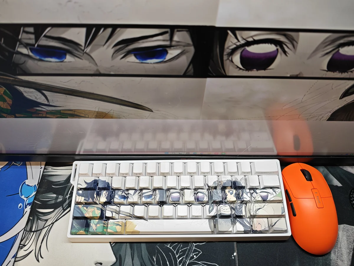 Close-up of exclusive Demon Slayer keycaps set featuring Giyu & Shinobu, highlighting their artistic translucent side-engraved legends. Perfect for fans.