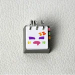 Resin Calendar Keycap, handcrafted, showcasing its intricate mood and weather calendar. Artistic desk art for reflection.