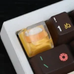 Joyful Dog Bowl Keycap handcrafted from vibrant resin, showcasing its charming miniature pet food bowl design with intricate details.