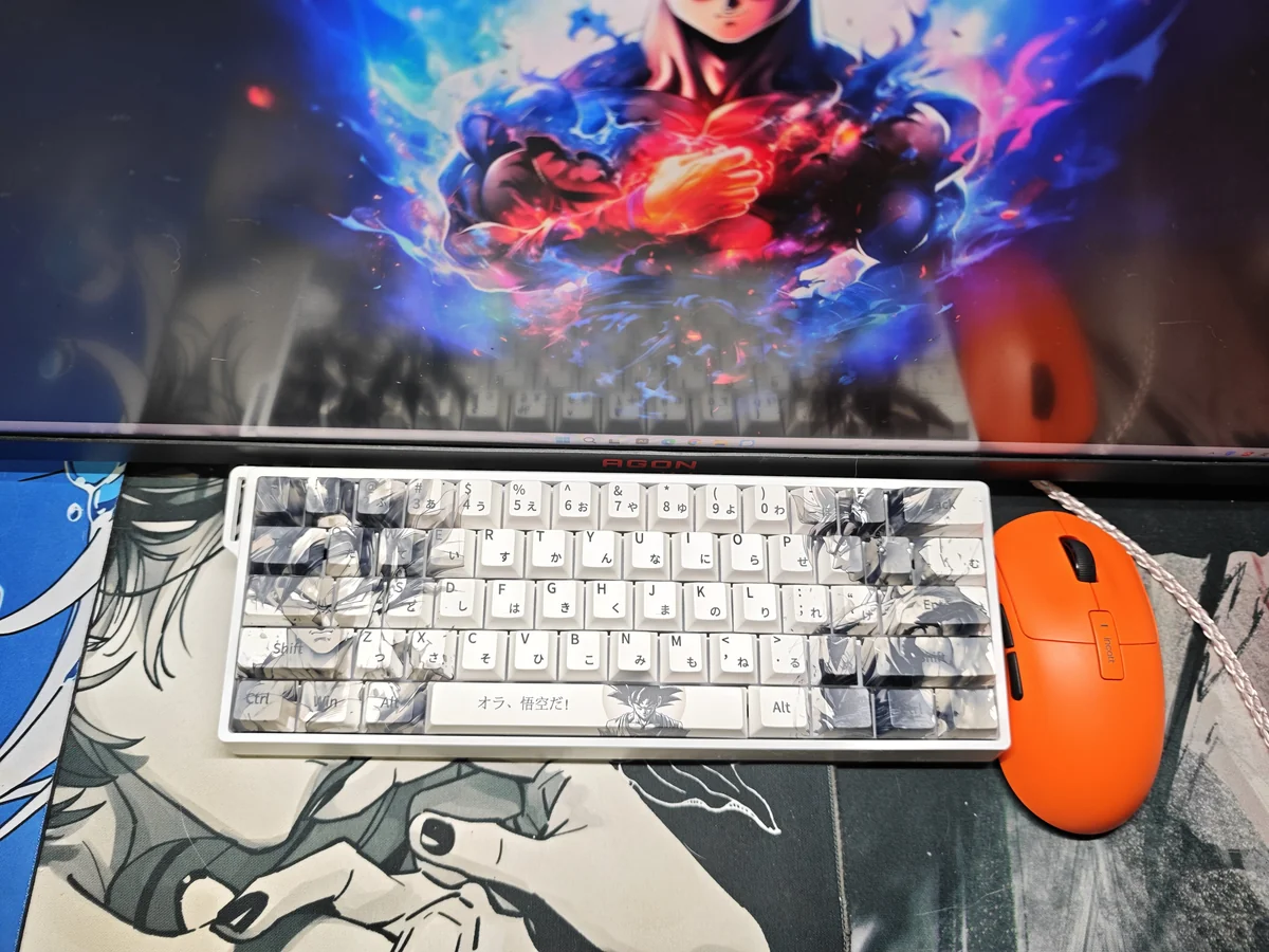 Gallery view of vibrant Dragon Ball Goku PBT keycaps set from various angles, highlighting iconic anime artwork and rich colors for a playful Saiyan keyboard.