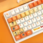 Vibrant Dragon Ball PBT backlit keycap set, showcasing a detailed side profile of iconic characters and dynamic art.