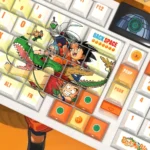 Premium Dragon Ball PBT backlit keycap set, side-engraved with vibrant character art and dynamic scenes, shown from various angles.