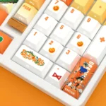 Close-up of premium Dragon Ball PBT backlit keycaps set, highlighting vibrant side-engraved character art and dynamic scenes from a unique angle.