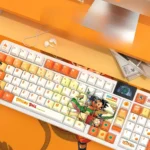 Vibrant Dragon Ball PBT backlit keycap set showcasing iconic power with dynamic, side-engraved character art for ultimate gaming nostalgia.