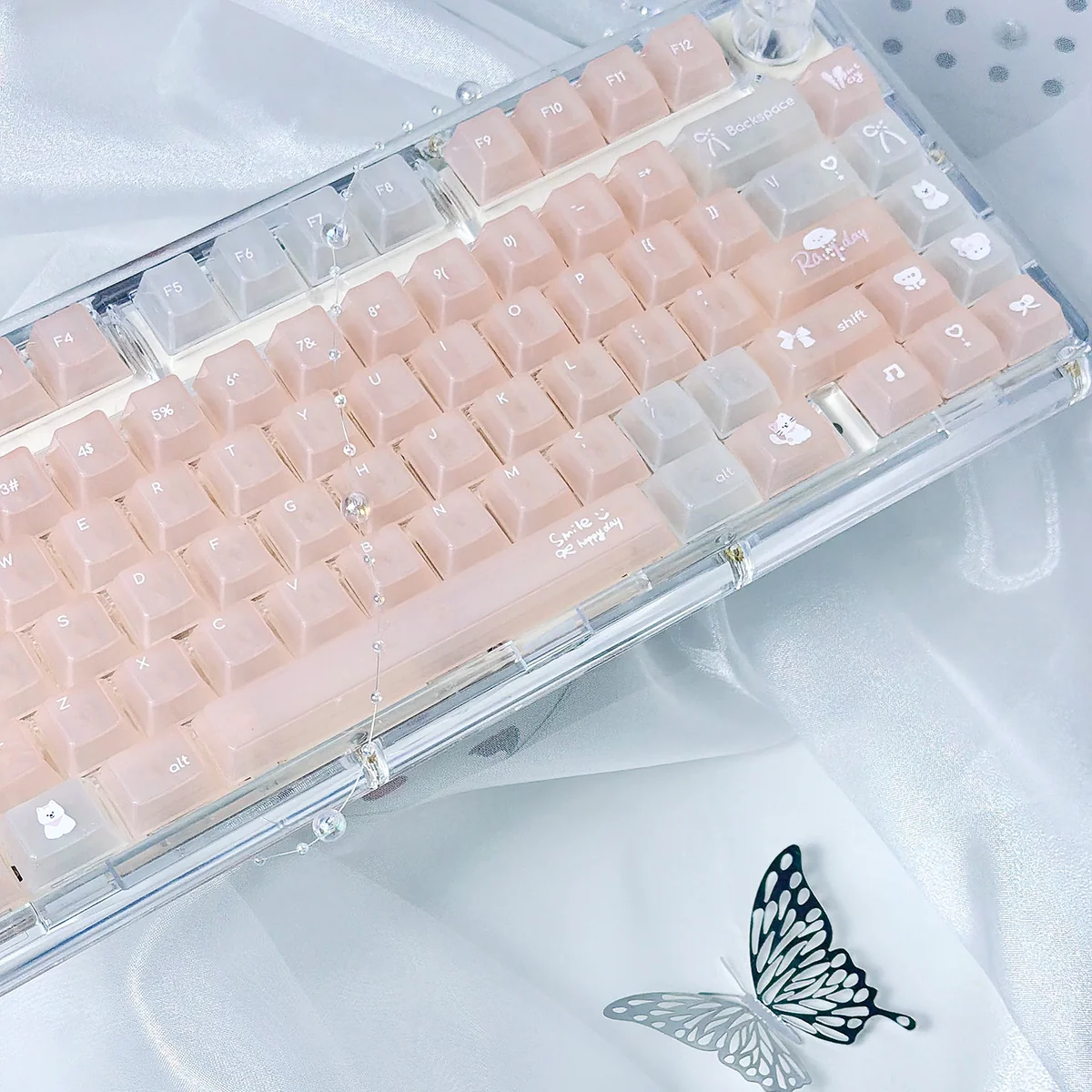 A close-up view of the Dreamy Star Glitter PC Keycap Set, showcasing the frosted translucent design and ethereal pastel glitter from various angles.