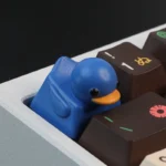 Adorable small blue duck resin keycap. This tactile stress relief variant brings playful charm and vibrant color to your keyboard.