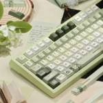 Premium PBT Dye-Sub Early Spring Green Keycaps showing gentle green gradients, subtle floral patterns, and a calming spring ambiance.