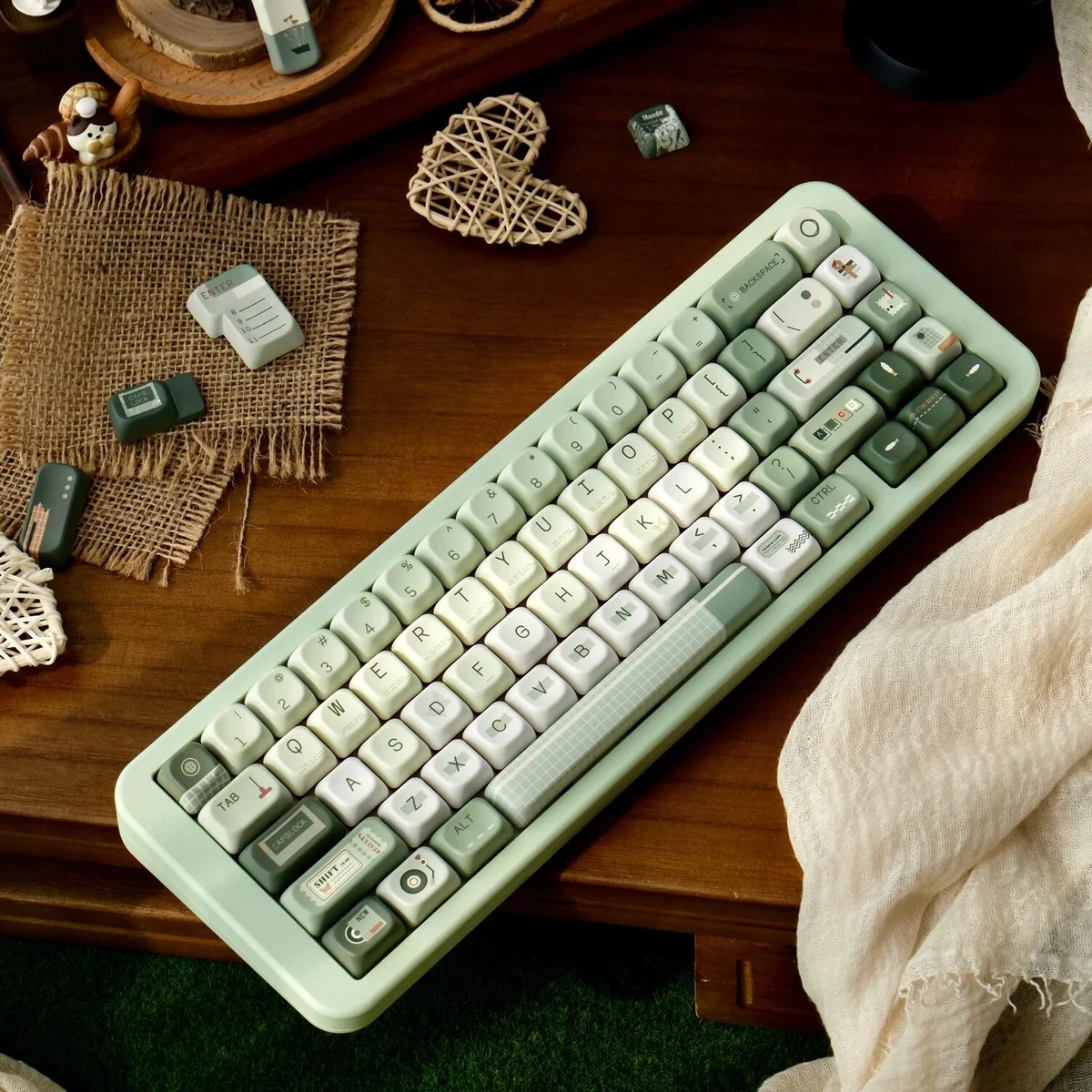 Early Spring Green Keycaps: Premium PBT Dye-Sub set displayed with gentle green gradients and subtle floral patterns, creating a calming.