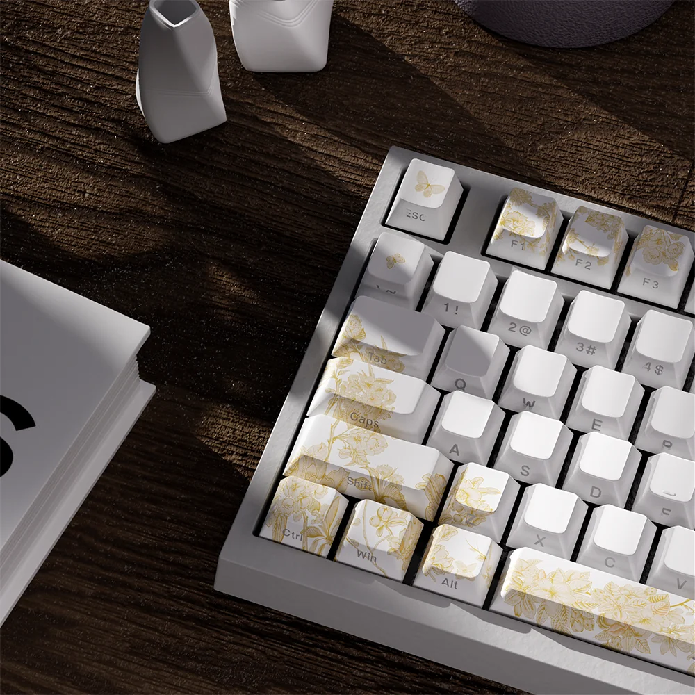 Refined elegance with embroidered PBT keycaps set, showcasing intricate patterns and luxurious finish from a distinct angle, enhancing premium design.