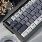Unique Emo Kitten PBT keycap set, displaying playful, expressive cat characters and its durable PBT finish from various angles.