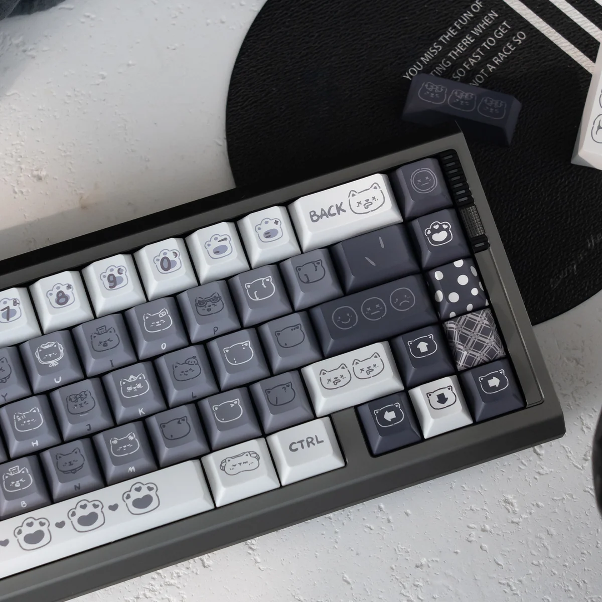 Emo Kitten PBT Keycap Set: detailed view from new angle, highlighting whimsical, expressive feline characters and durable PBT finish.