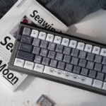 Unique Emo Kitten PBT keycap set from a dynamic angle, highlighting soft, durable finish and whimsical, expressive cat characters.