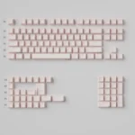 Ethereal pink translucent PBT keycaps from the Refraction set, featuring a unique hollow design and stunning light effects that create a captivating design.