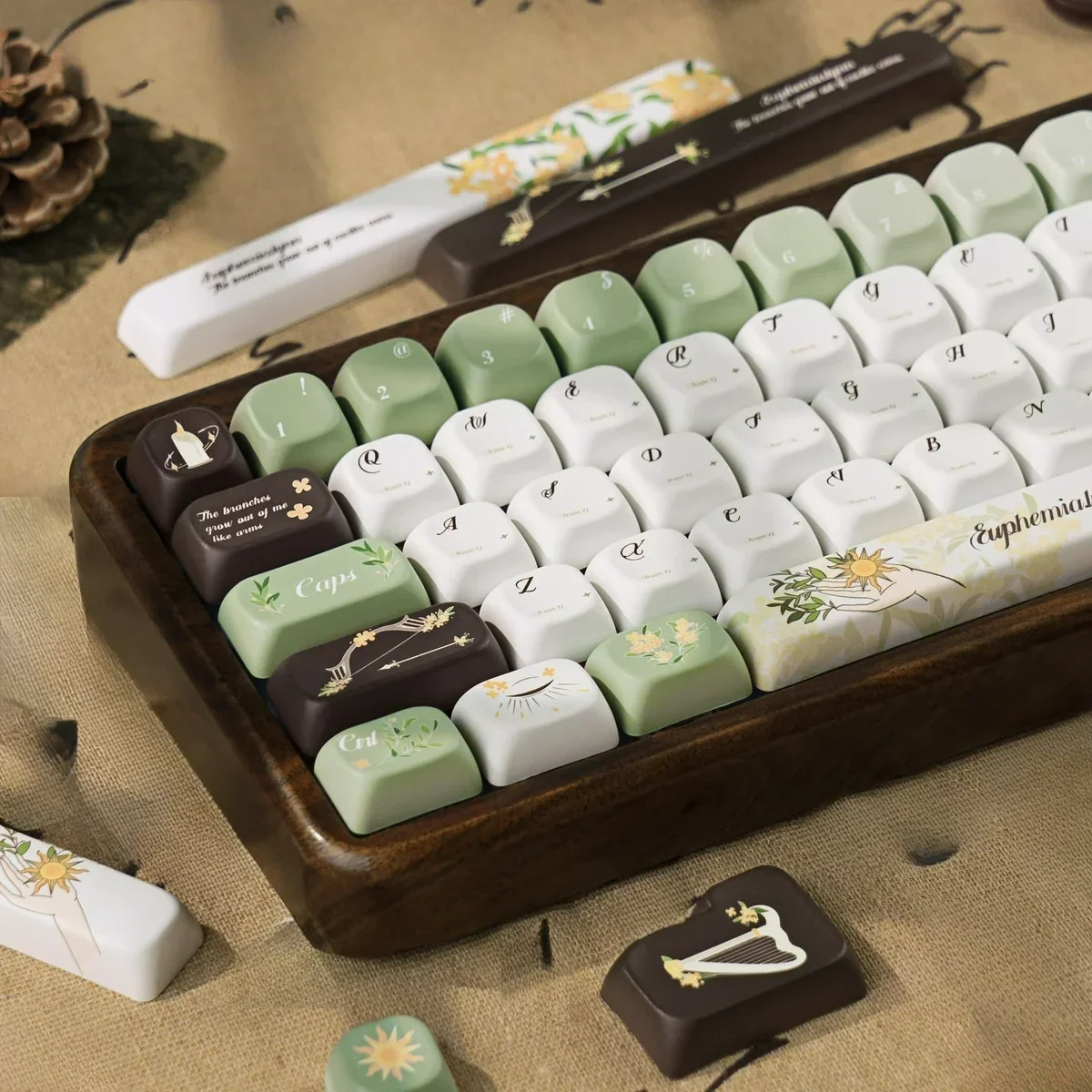 Elegant Euphemialynn PBT dye-sub keycaps set, presented from multiple angles, highlighting the serene classical mythology artwork, delicate laurel motifs.