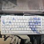Artistic display of Rei Ayanami Evangelion PBT keycaps set from multiple angles. Shows iconic anime aesthetic and unique Rei Ayanami theme.