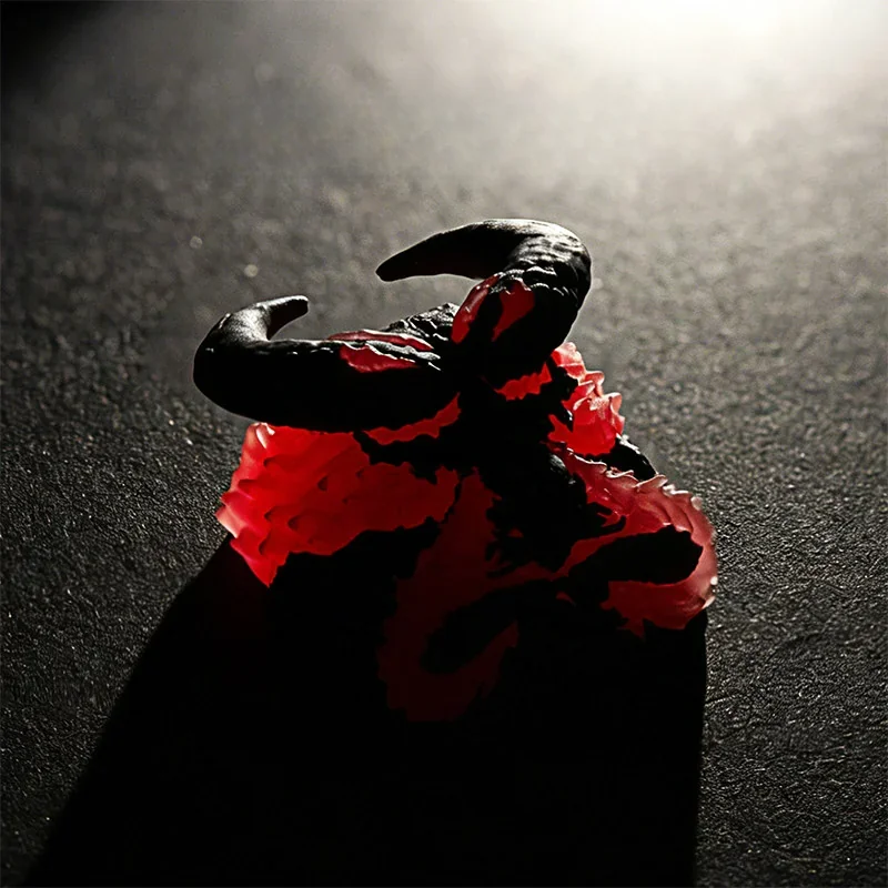 Close-up of a backlit artisan resin keycap, showcasing its dynamic molten red flame and collapsing beast design, an artistic blend of power.