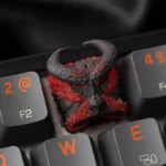 Artistic backlit resin artisan keycap featuring a dynamic molten red fiery beast design, unleashing intense power and destructive beauty.