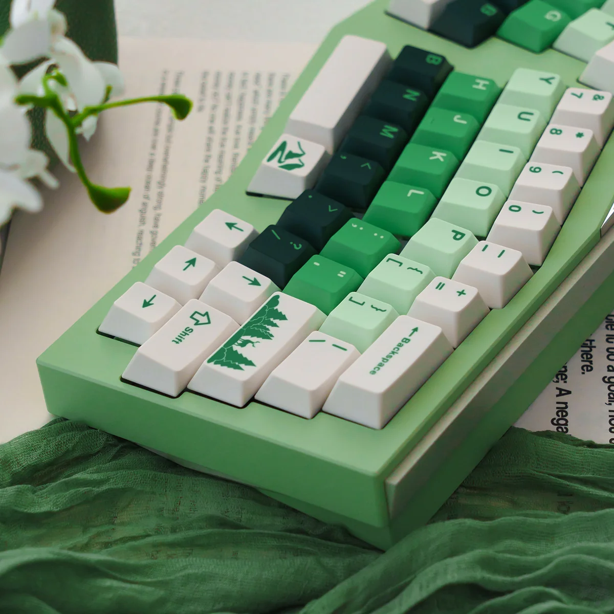 Forest PBT Keycaps Set, presented from a unique angle, highlighting the lush green gradient and detailed dye-sub legends for a serene, artistic desktop setup.
