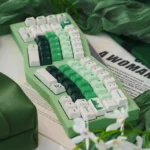 Multiple angles of the Forest PBT Keycaps Set reveal the lush green gradient, PBT dye-sub craftsmanship, and tranquil forest aesthetic for serene desktop.