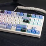 Exclusive Genshin Impact Columbina PBT keycaps set from an artistic side angle, revealing delicate ethereal character art and celestial, moon-inspired.