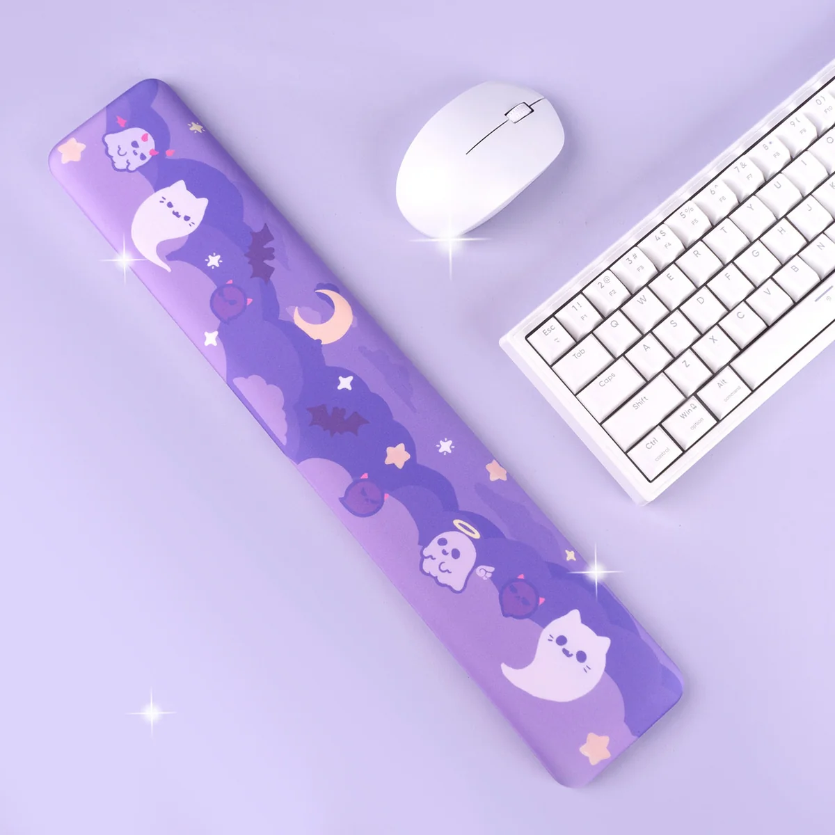 A detailed view of the playful ghost desk mat and matching wrist rest, featuring charming ghost figures. This oversized set creates a unique design.