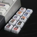 Close-up of the whimsical Gintama sleeping artisan resin 10-keycap set, showcasing glossy finish, vibrant details, and playful characters from various angles.