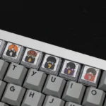 A close-up view of the whimsical Gintama sleeping artisan resin 10-keycap set, showcasing vibrant details and glossy finish from multiple artistic angle.