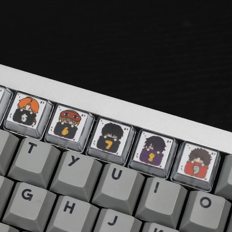 A close-up view of the whimsical Gintama sleeping artisan resin 10-keycap set, showcasing vibrant details and glossy finish from multiple artistic angle.