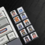 Whimsical Gintama sleeping artisan resin 10-keycap set. Detailed angle view shows vibrant colors, glossy finish, and peaceful slumbering characters.