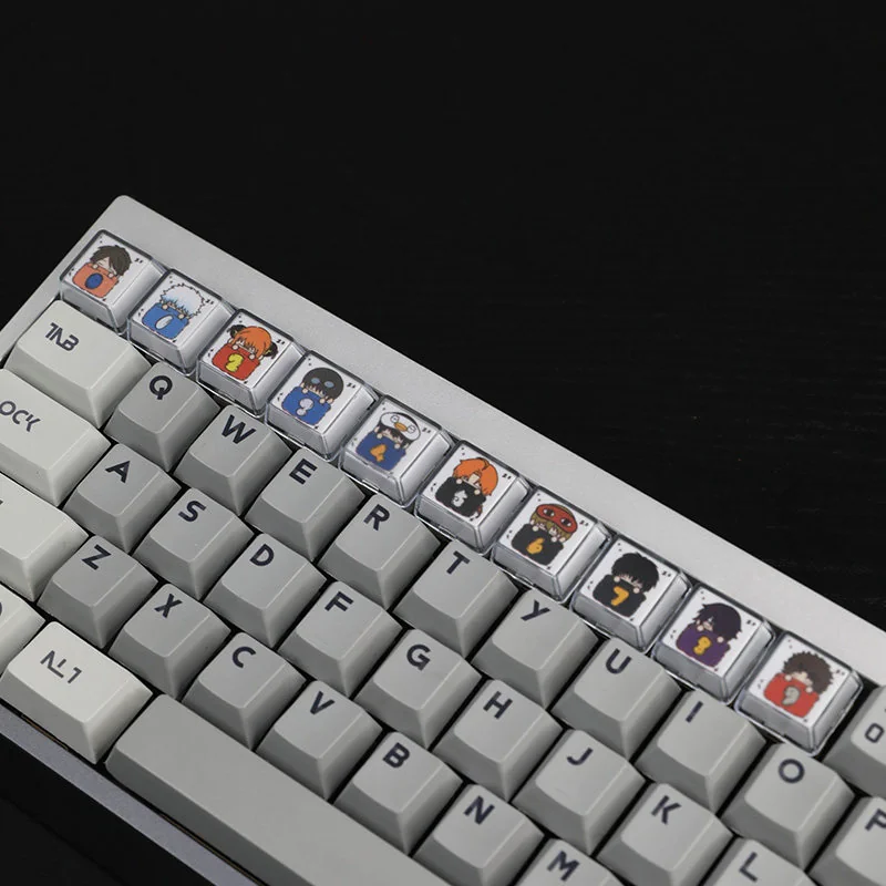 Whimsical Gintama sleeping artisan resin 10-keycap set, showcasing vibrant characters in peaceful slumber with glossy, playful details.