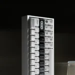An artistic view of the OPXY White Cherry Keycap Set, showcasing the striking monochromatic fluidity and premium texture from a unique angle.
