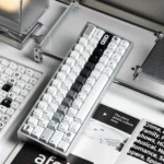 Close-up of OPXY White Cherry Keycap Set showcasing the sophisticated monochromatic blend and fluid transition, highlighting the striking design.